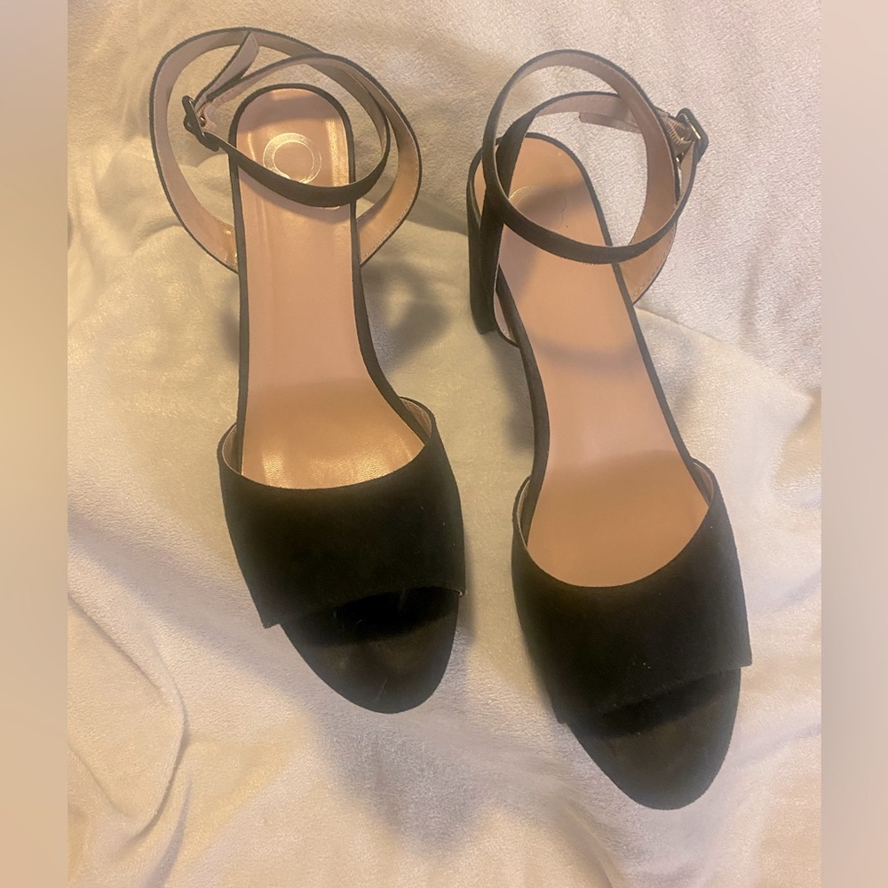 Women's black strap low heel size 12 shoe.